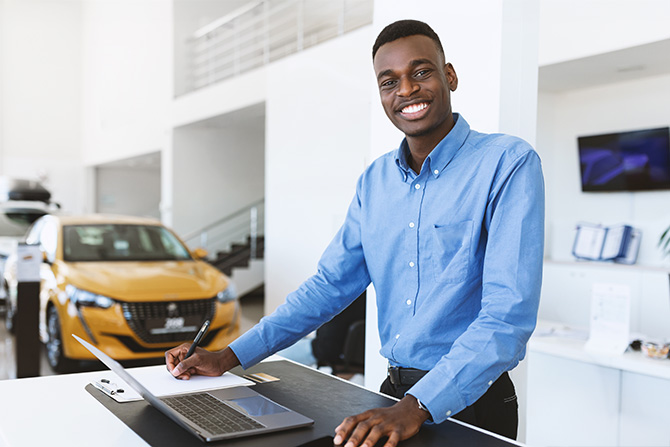 Smiling auto dealer