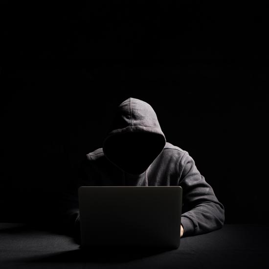 Hacker at laptop